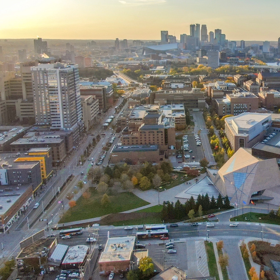 Aerial shot of the Stadium Village neighborhood with the Minneapolis skyline in the background